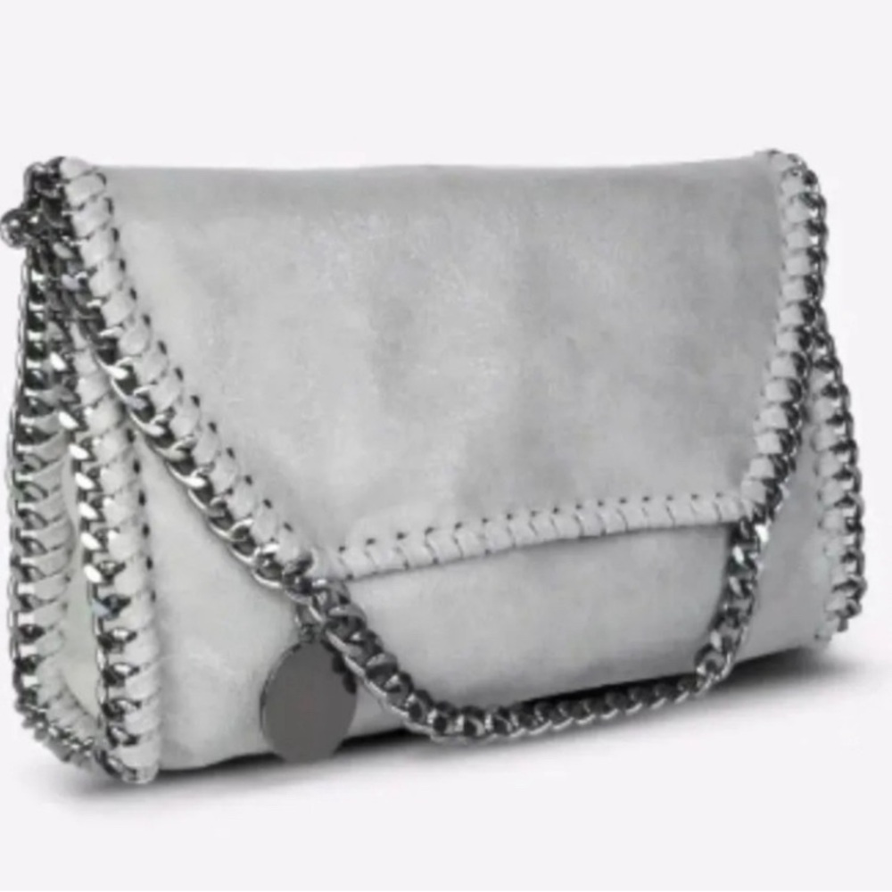 NWT, vegan leather Alicia Crossbody bag. Can be worn as clutch or crossbody.